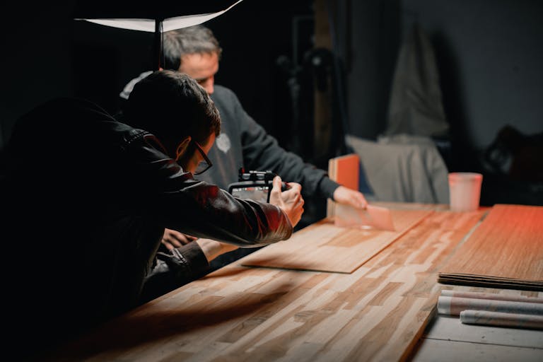 Two photographers working on a creative studio photoshoot.