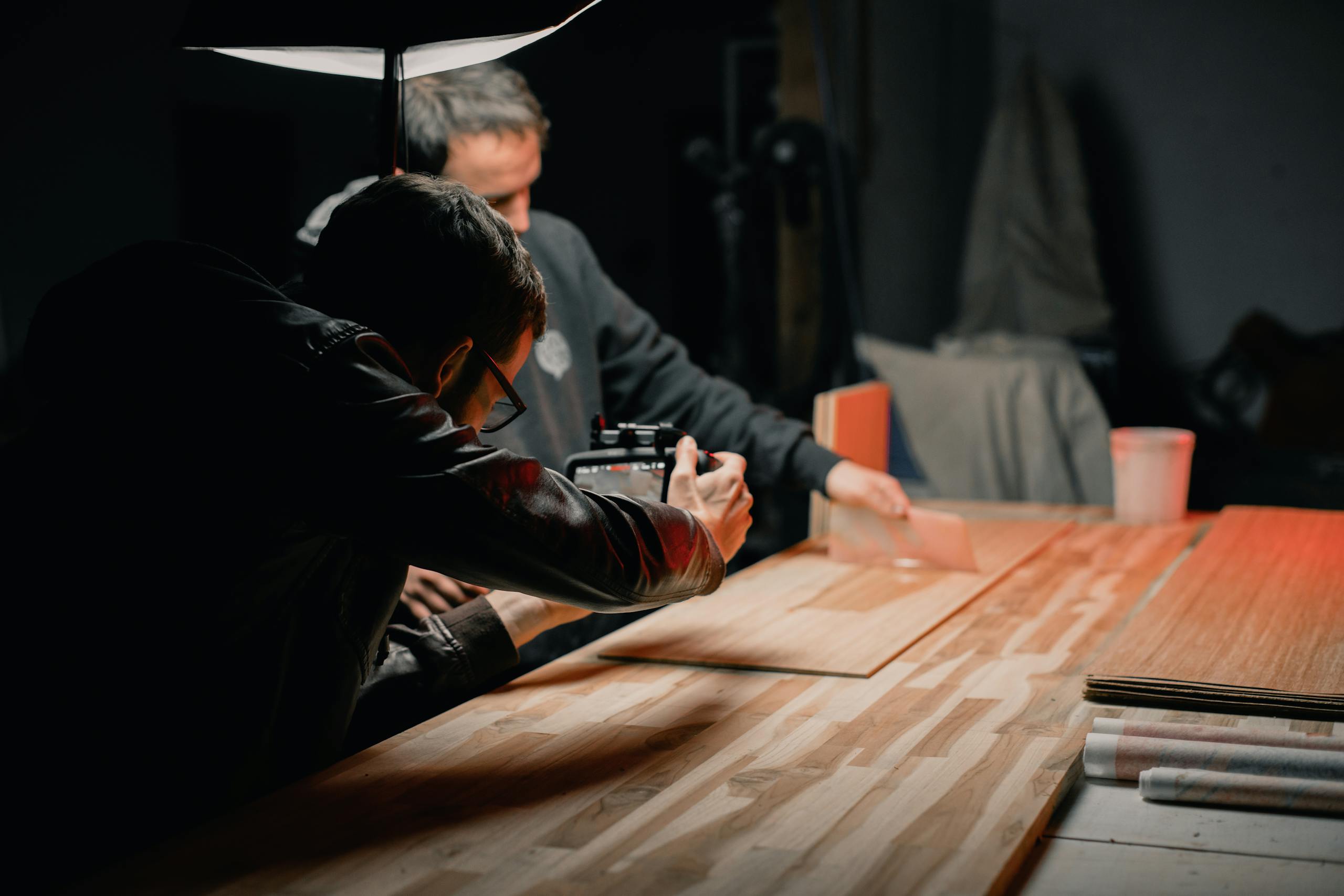 Two photographers working on a creative studio photoshoot.